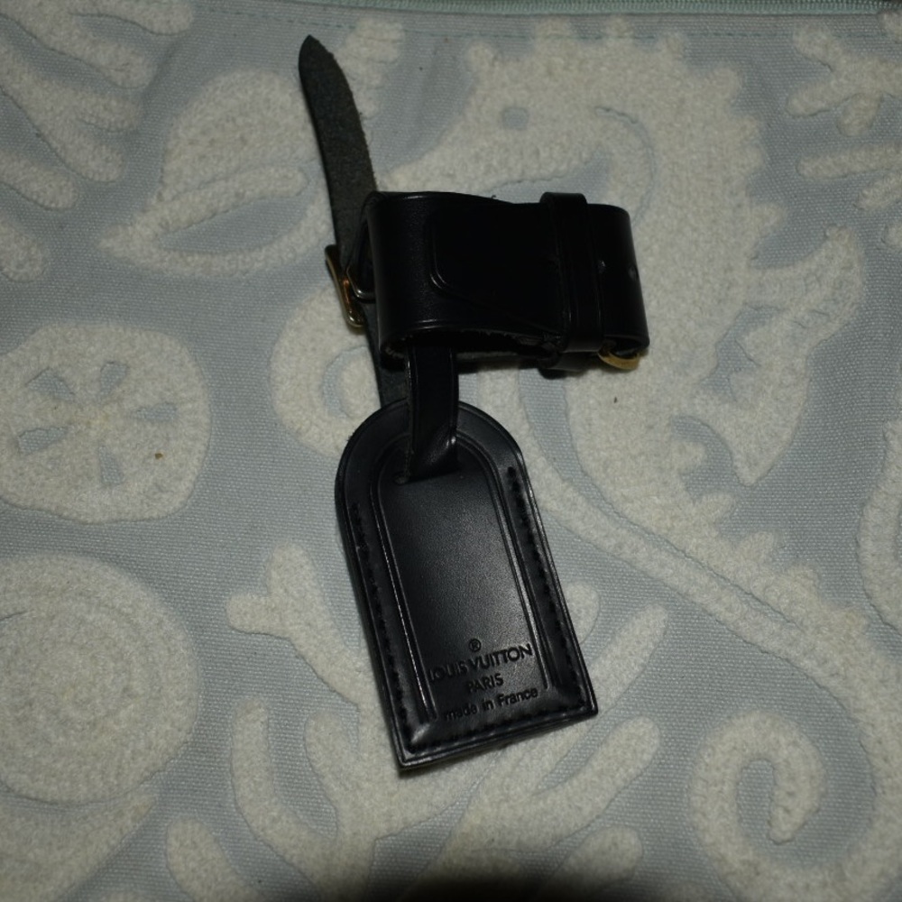 Authentic mini LV smooth black tag
